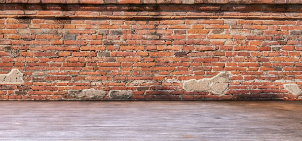 istock Old brick wall with wood floor interior room 2085924195