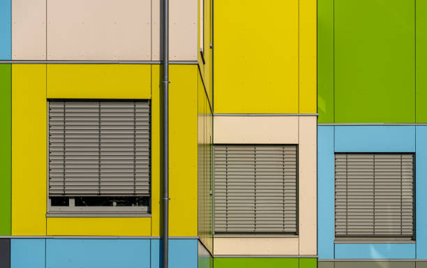 Vibrant Modern Facade with Geometric Patterns and Reflective Windows