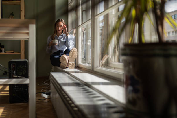 istock Tired Businesswoman Seeking Respite on Ledge 2085973165