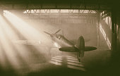 Silver Supermarine Spitfire In Aircraft Hangar (Scale Model Photography)