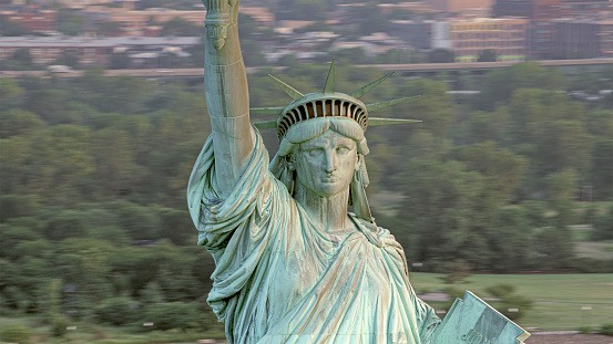 Close up of the Statue of Liberty in New York, USA. Blue sky background with copy space