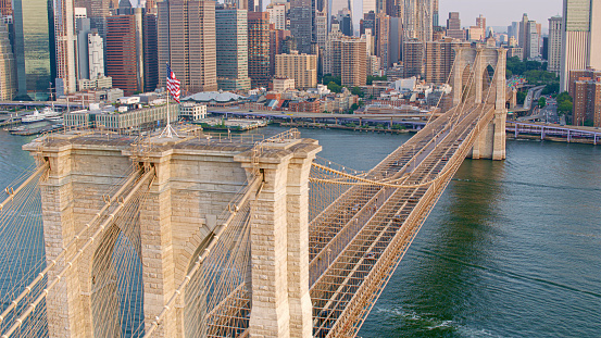 Aerial view of Brooklyn Bridge over East River with downtown Manhattan Skyscrapers in New York City, New York State, USA.
