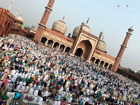 Eid congregation at the Jama Masjid, Delhi, India. Biannual Eid festival congregation at the Jama Masjid, Delhi. Eid al-Fitr is on the first day of the month of Shawwal (Islamic Calendar) and marks the end of Ramadan (month long fasting) and the beginning of a feast that breaks the fast.