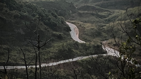 Aerial view of the road in the mountains. View from above hill.