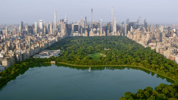 Aerial view of Central Park with Central Park Reservoir surrounded by modern skyscraper in New York City, New York State, USA.