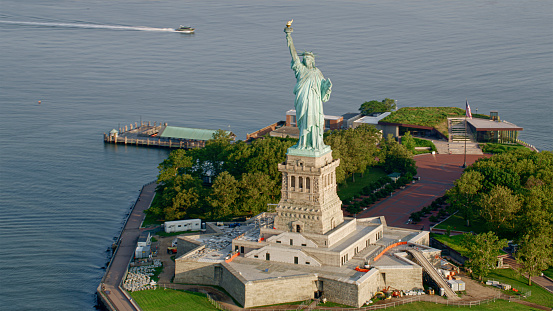 Aerial view of Statue of Liberty on Liberty Island in sea New York City, New York State, USA.