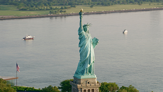 Aerial view of Statue of Liberty on Liberty Island in sea New York City, New York State, USA.