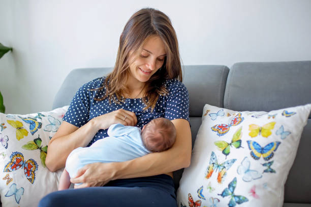 istock Young mother breastfeeding  her newborn baby boy 2086013367