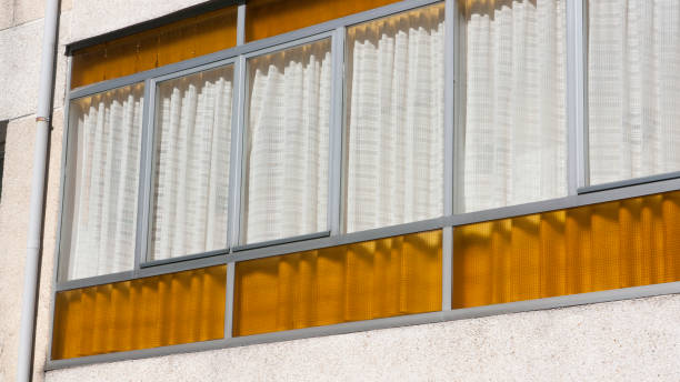 istock Yellow glass in building window 2086014430