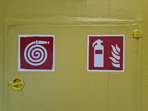 Symbols for his ane extinguisher on yellow background