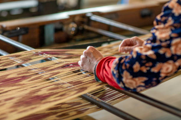 istock old woman hand on a silk cloth 2086018130