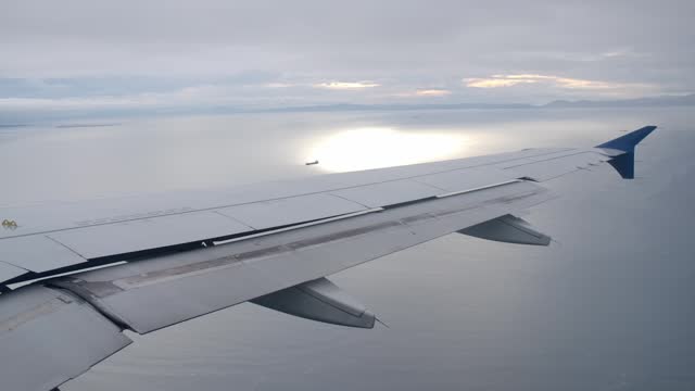 De-banking Airplane in Flight, Passenger View of Aircraft Wing