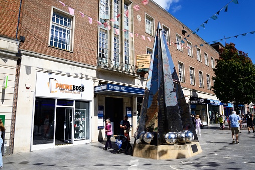 View of the Exeter Riddle sculpture along High Street in the city centre, Exeter, Devon, UK, Europe.