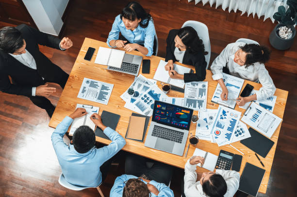istock Wide top view diverse analyst team analyzing financial data. Habiliment 2086027620
