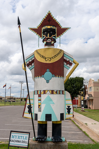 Elk City, United States – September 04, 2023: A colorful totem pole sculpture near a roadside