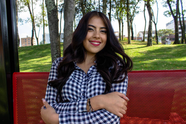 istock Beautiful young woman posing in a public park 2086088007