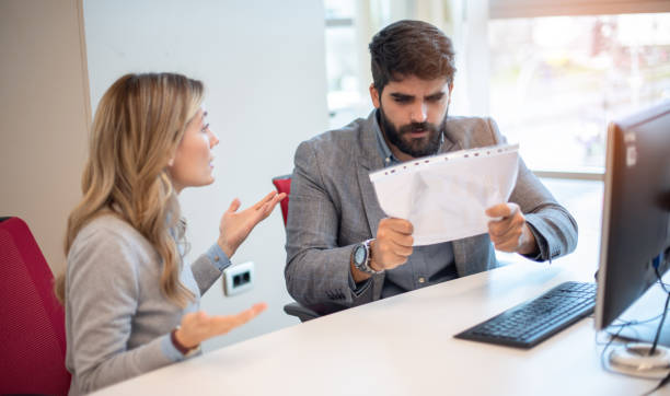 istock Two business colleagues having disagreement and conflict in office. 2086092632