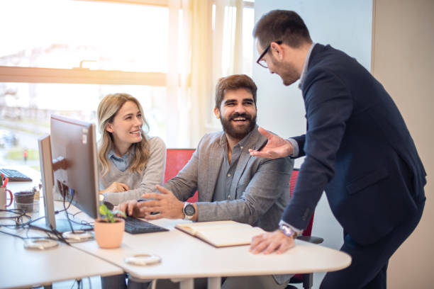 istock Three business colleagues discussing project, sharing ideas, considering strategy at workplace. 2086106828