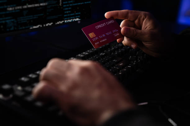 istock Cropped hands image in criminal anonymous male approaching credit card. Surmise. 2086112745