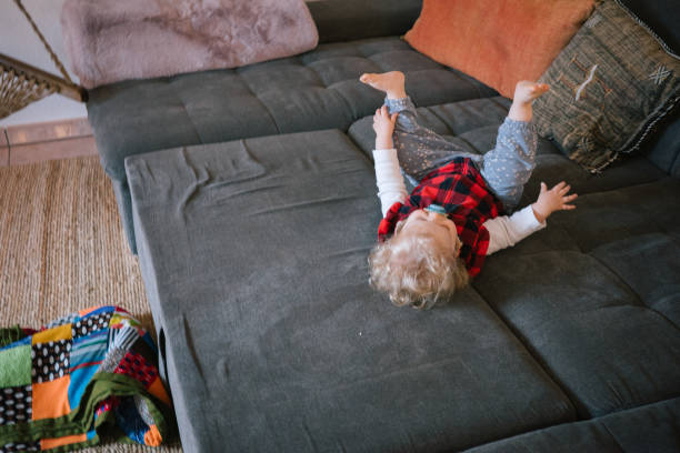 istock Baby relaxes in living room 2086119632