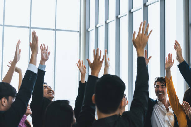 istock Successful business people raised their hands up for voting. Intellectual. 2086136601