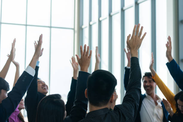istock Successful business people raised their hands up for voting. Intellectual. 2086153901