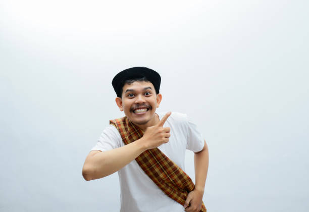 asia muslim man with saroong pointing something with his hands