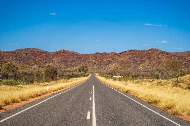 istock Outback road running towards mountain 2086170988