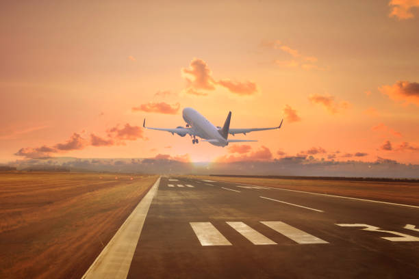istock Passenger airplane landing at sunset 2086180017