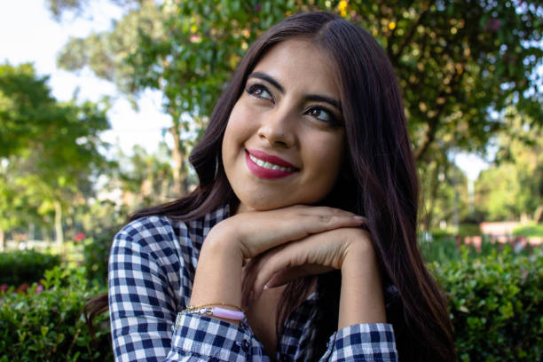 istock Beautiful young woman posing in a public park 2086191285