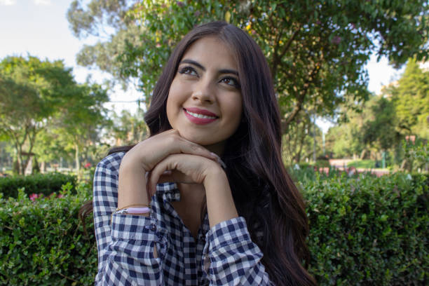 istock Beautiful young woman posing in a public park 2086191307