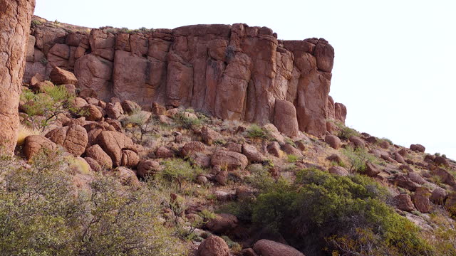 Mountain erosion formations of red mountain sandstones, desert landscape. Arizona, Phoenix neighborhood
