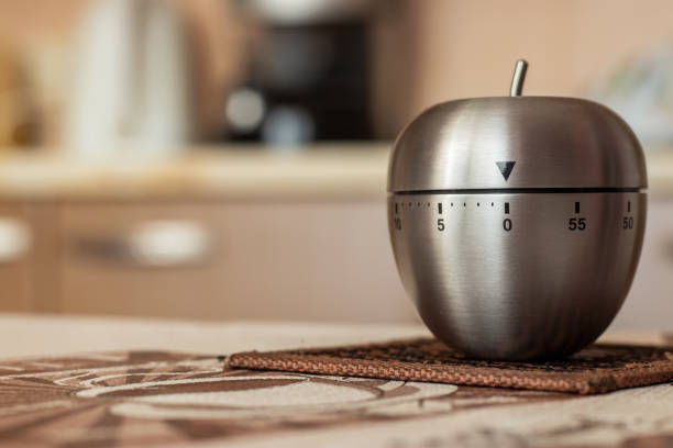 kitchen timer in shape of apple on table. space for text - timer cooking domestic kitchen time zdjęcia i obrazy z banku zdjęć