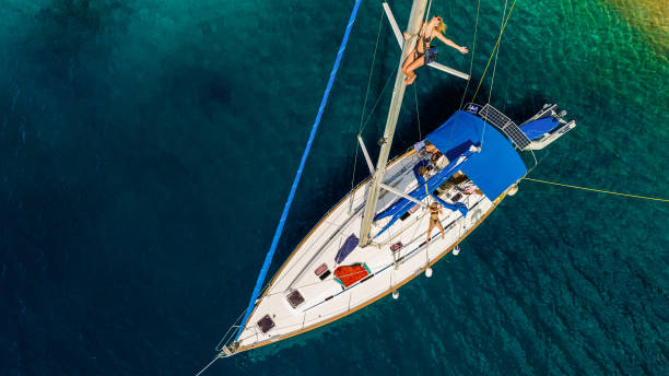 istock Group of young people enjoying vacation on sailboat 2086312802