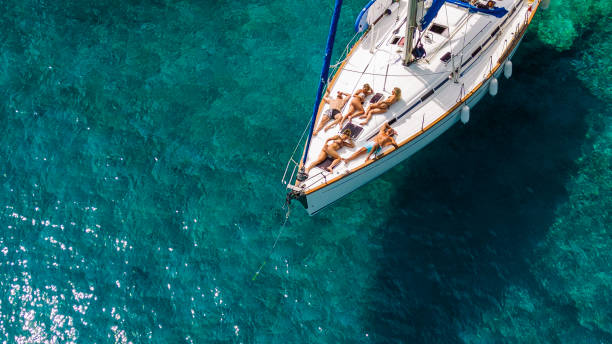 istock Group of young people enjoying vacation on sailboat 2086314918