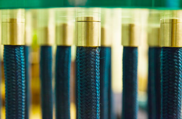 Flexible legs of a glass table close-up.