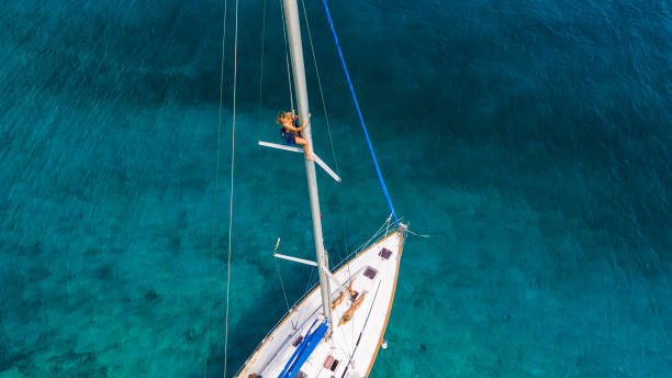 istock Group of young people enjoying vacation on sailboat 2086315219