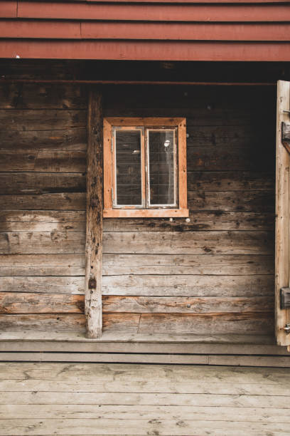 old window on the wooden wall in Norway