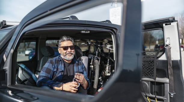 istock Mature Indian man getting ready for cycling trip 2086362282