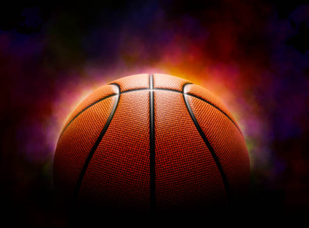basketball on the color smoke background - speelveld fotos stockfoto's en -beelden