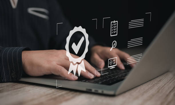 istock Concept of guarantee standards iso certification and standardization service quality and assurance : Businessman Is using a laptop to verify or certify something after he has verified it. 2086390271