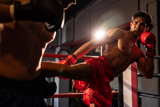 istock Asian and Caucasian Boxer unleash kick attack. Impetus 2086404873