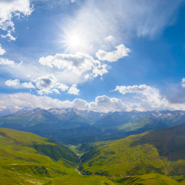 green mountain valley under a sparkle sun