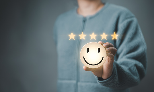Customer review satisfaction feedback survey concept. Best Excellent Services Rating for Satisfaction present by Hand of Client Showing smile face with excellent rating Five Star. Customer experience,