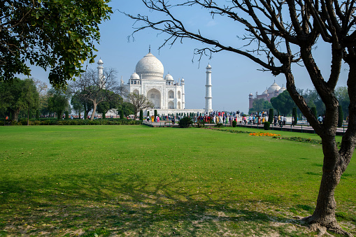 Agra, India - March 13 2024: The Taj Mahal at Agra India. It was commissioned in 1631 by the fifth Mughal emperor, Shah Jahan to house the tomb of his beloved wife, Mumtaz Mahal.