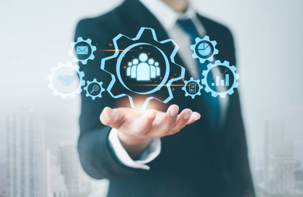 istock Customer relations, business management, internet, technology icons set Businessman's hands holding human icons for customer value and customer service and corporate concepts. 2086470965