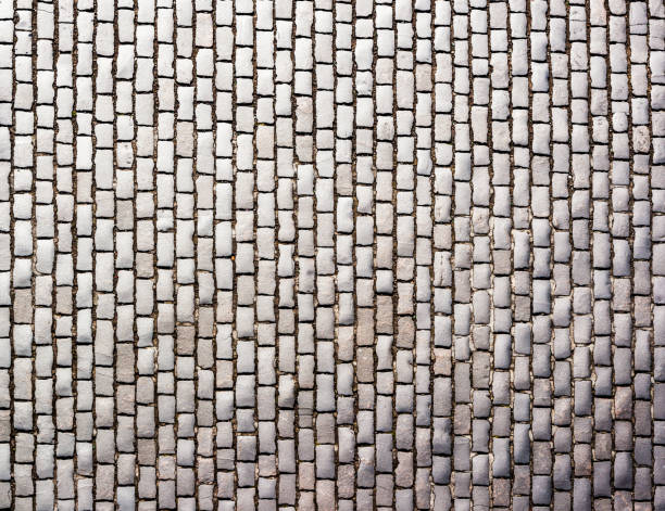 Traditional cobblestones from above A large surface of an old-fashioned cobbled street in Edinburgh, Scotland. Photographed from directly above. cobblestone stock pictures, royalty-free photos & images