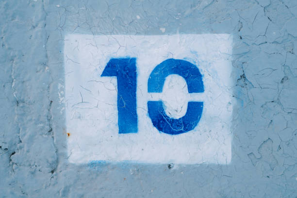 istock Number ten drawn in a white rectangle on a blue wall 2086497054