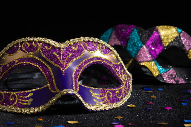 istock Masquerade mask with confetties on black background. 2086499886