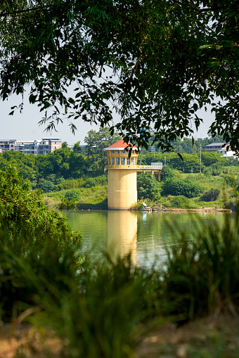 Architectural landscape of hydrological tower by the river